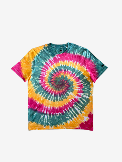 A short-sleeve crewneck tie-dye t-shirt featuring a vibrant spiral pattern in  green, red, and yellow, laid flat against a light gray background.
