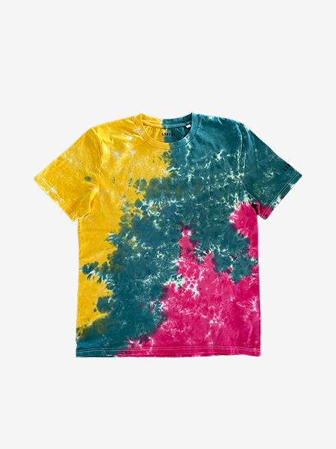 A short-sleeve crewneck t-shirt featuring a vibrant tie-dye pattern with three distinct colors: yellow on the left, green on the right, and red on the lower right. The shirt is displayed flat against a clean, light gray background.