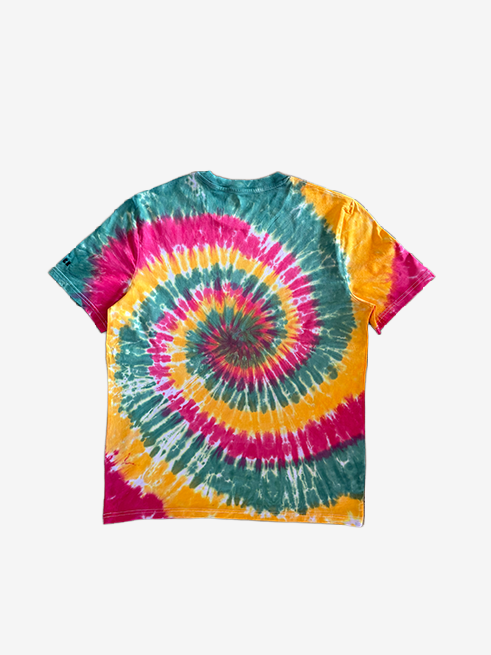 A short-sleeve crewneck t-shirt featuring a vibrant spiral tie-dye pattern with green, red, and golden yellow colors, laid flat against a light gray background.