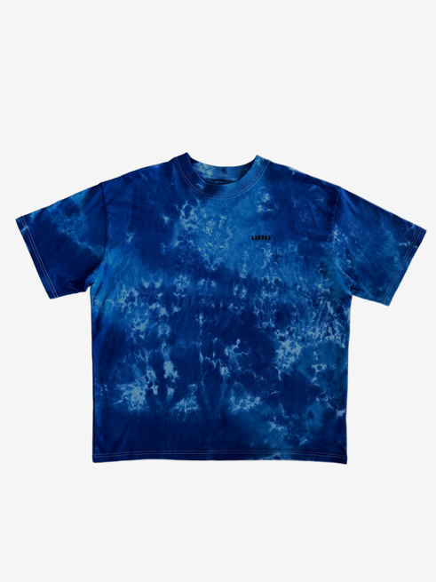 A blue and navy tie-dye short-sleeve t-shirt with a small black 'LISTEE' logo on the left chest, displayed flat against a light gray background.